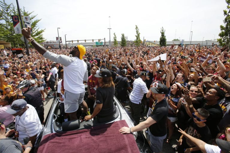 Crowd swarms Cleveland for Cavs title parade, rally