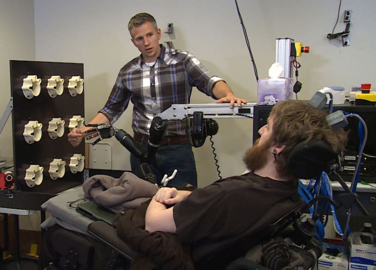In a medical first, brain implant allows paralyzed man to feel again