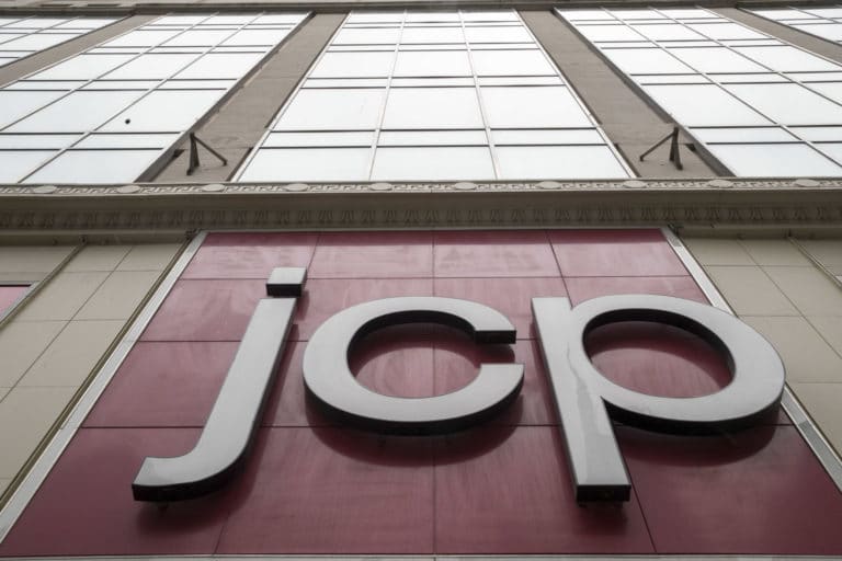 JCPenney halves losses, will begin selling used clothing