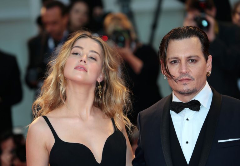 Johnny Depp and Amber Heard settle divorce case a day before restraining-order hearing