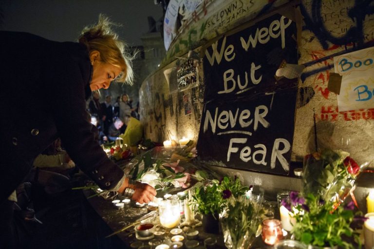 France bombs Islamic State HQ, hunts attacker who got away