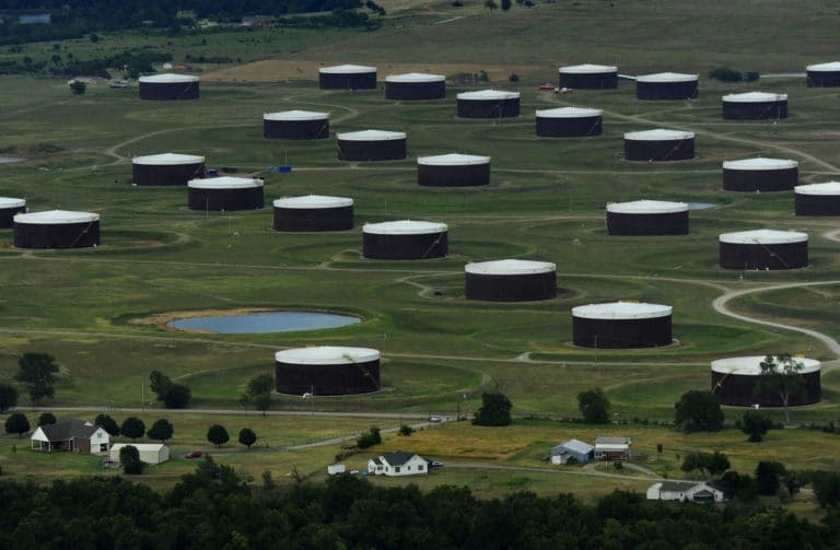 Oil glut to ease in second half of year, IEA says