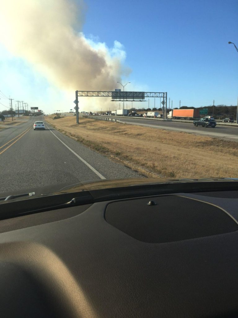 Homes evacuated, roads closed due to North Texas wildfires