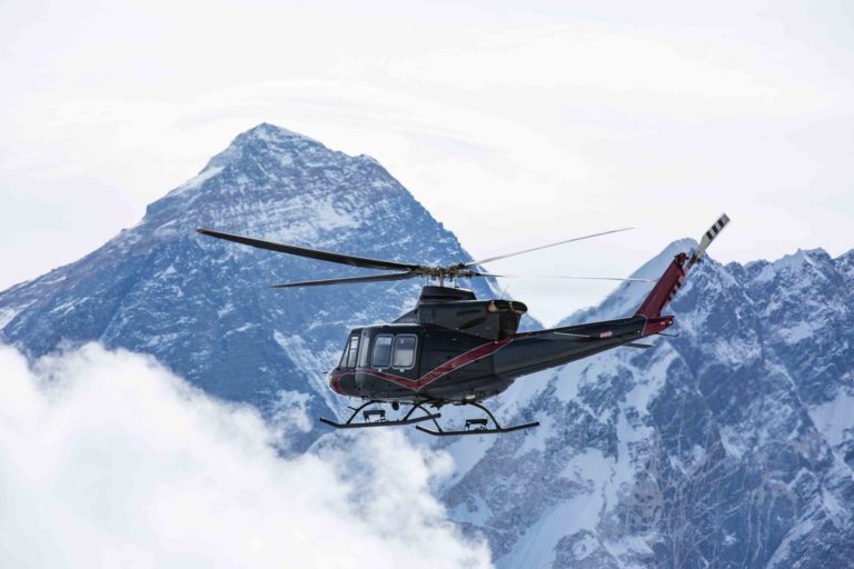 Bell demonstrates 412 helicopter in Nepal, flying near Mount Everest
