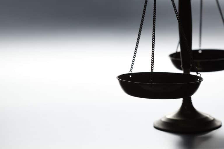 White father, son charged with murder in black man’s death