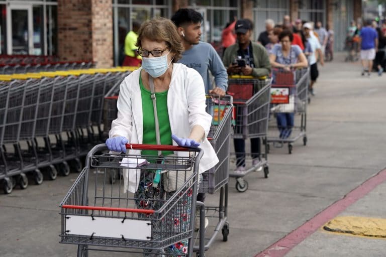 As daily virus deaths spike, Texas reopens door for business