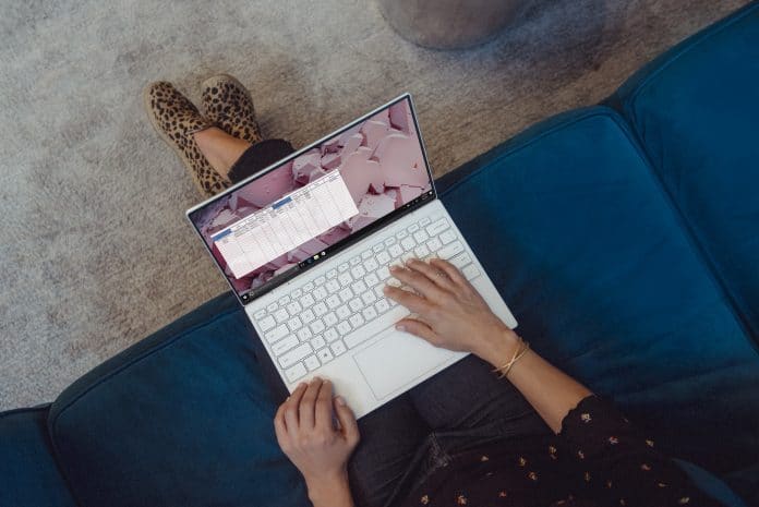 person using white laptop computer