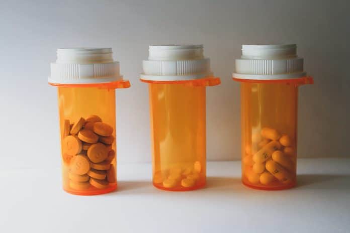 orange and white plastic medicine bottle