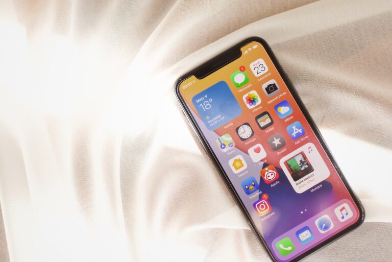 silver iphone 6 on white textile