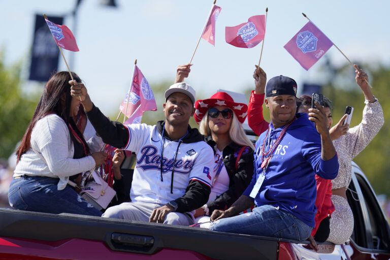 Thousands greet Rangers at World Series parade