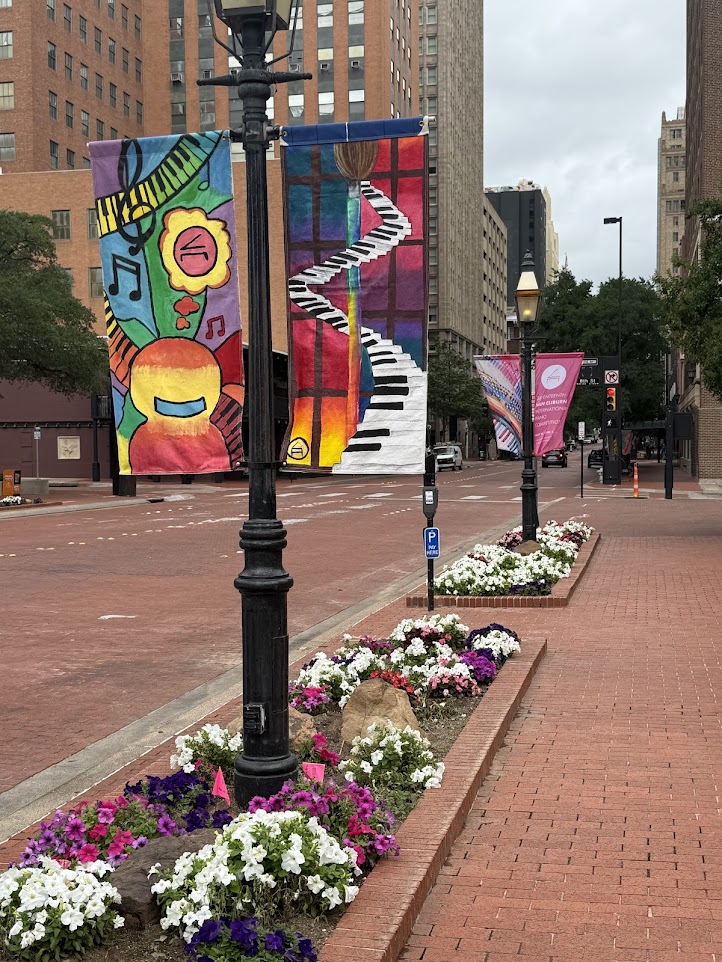 STUDENT-PAINTED CLIBURN BANNERS IN DOWNTOWN FORT WORTH; 2025 COMPETITORS HEAD TO LOCAL LIBRARIES
